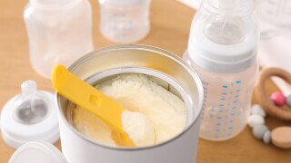 Can,Of,Powdered,Infant,Formula,With,Scoop,On,Table,,Closeup.