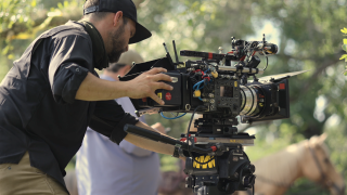 A photographer on set of the movie "Florida Wild" 