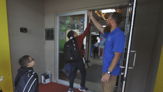 Padraic Roney greets kids at the Musso Boys and Girls Club in Lakeland, Florida.